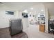 Finished basement featuring a cozy living area and modern washer and dryer set at 536 N Williams St, Denver, CO 80218