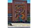 Exterior facade of Cherry Creek building showcasing a large, colorful art mural made of bricks at 536 N Williams St, Denver, CO 80218