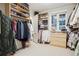 Spacious walk-in closet with custom shelving, hanging racks, natural light, and built in storage at 536 N Williams St, Denver, CO 80218