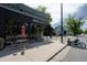 Exterior of Novo Coffee shop with modern glass facade and outdoor seating on the sidewalk at 536 N Williams St, Denver, CO 80218