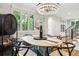 Elegant dining room featuring hardwood floors, large windows, and modern furnishings at 536 N Williams St, Denver, CO 80218