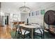Stylish dining area with modern chandelier, dining table, and open layout to the kitchen at 536 N Williams St, Denver, CO 80218