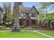Beautiful two-story Tudor home with manicured lawn, brick accents, and mature trees at 536 N Williams St, Denver, CO 80218