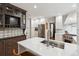Modern kitchen with stainless steel appliances, white countertops, and custom cabinetry at 536 N Williams St, Denver, CO 80218