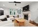 Living room with tiled floors, fireplace, and view of the neighborhood from the many windows at 536 N Williams St, Denver, CO 80218