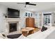 Cozy living room featuring fireplace with mantel and French doors leading to sunroom at 536 N Williams St, Denver, CO 80218