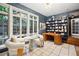 Home library features dark blue accent wall, built-in bookcase, and views of the exterior at 536 N Williams St, Denver, CO 80218