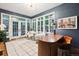 Home library features dark blue accent wall, built-in bookcase, and views of the exterior at 536 N Williams St, Denver, CO 80218