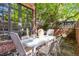 Outdoor dining area on the back patio, adjacent to a brick home exterior at 536 N Williams St, Denver, CO 80218