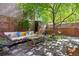 Charming backyard patio area featuring a comfortable outdoor sofa, perfect for relaxation at 536 N Williams St, Denver, CO 80218