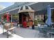 Charming storefront with striped awning, red door, and outdoor seating area at 536 N Williams St, Denver, CO 80218