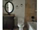 Well-maintained bathroom featuring modern fixtures, tile accents, and a combined tub and shower at 12512 E Cornell Ave # 101, Aurora, CO 80014