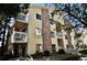 Inviting condo building featuring brick accents and private balconies perfect for relaxing and enjoying the outdoors at 12512 E Cornell Ave # 101, Aurora, CO 80014