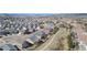 Panoramic aerial perspective capturing a sprawling residential area, showcasing community and scenic backdrop at 3323 Starry Night Loop, Castle Rock, CO 80109