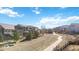 Expansive aerial view of neighborhood homes featuring a path, open spaces, and well-maintained landscaping at 3323 Starry Night Loop, Castle Rock, CO 80109