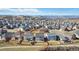 Overhead view of a vibrant neighborhood with well-maintained homes, lush landscaping, and picturesque mountain views at 3323 Starry Night Loop, Castle Rock, CO 80109