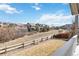 Scenic backyard view showcasing a well-maintained path and picturesque neighborhood homes on a sunny day at 3323 Starry Night Loop, Castle Rock, CO 80109