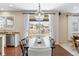 Dining area with hardwood floors, modern lighting, and a sliding glass door at 3323 Starry Night Loop, Castle Rock, CO 80109