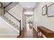 Inviting entryway with wood floors, staircase, and a view into the dining area at 3323 Starry Night Loop, Castle Rock, CO 80109