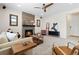 Comfortable living room featuring a fireplace with a stone surround and modern decor at 3323 Starry Night Loop, Castle Rock, CO 80109