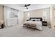 Bright main bedroom with gray carpet, bench seating, and stylish decor at 3323 Starry Night Loop, Castle Rock, CO 80109