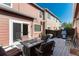 Private patio with grill, outdoor seating, and convenient access to the home at 22725 E Ottawa Pl, Aurora, CO 80016