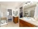 Bathroom features double sinks, neutral tile countertops, a walk-in closet and shower at 22725 E Ottawa Pl, Aurora, CO 80016