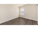 Unfurnished bedroom with modern vinyl floors and neutral walls at 22725 E Ottawa Pl, Aurora, CO 80016