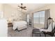 Bedroom with a fan and many windows at 22725 E Ottawa Pl, Aurora, CO 80016