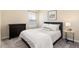 Bedroom features a queen bed, black dresser and a sunny window at 22725 E Ottawa Pl, Aurora, CO 80016