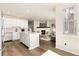 Open concept living space with kitchen island and fireplace at 22725 E Ottawa Pl, Aurora, CO 80016