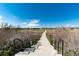 Path leading through a community green space great for walks and outdoor activities at 22725 E Ottawa Pl, Aurora, CO 80016