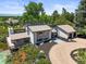 An aerial view showcases the home's unique architecture and pristine landscaping at 4 Greenridge Rd, Greenwood Village, CO 80111