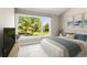 Comfortable bedroom featuring a large window with views of the trees outside at 4 Greenridge Rd, Greenwood Village, CO 80111