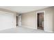 An empty bedroom featuring a closet and an ensuite bathroom at 4 Greenridge Rd, Greenwood Village, CO 80111