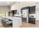 Bright kitchen with a large island, stainless steel appliances, and ample counter space at 4 Greenridge Rd, Greenwood Village, CO 80111