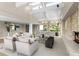 Open living space with vaulted ceilings, fireplace, and lots of natural light at 4 Greenridge Rd, Greenwood Village, CO 80111