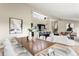 Open living space features a modern kitchen, dining area, and living room with seamless flow and natural light at 4 Greenridge Rd, Greenwood Village, CO 80111