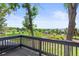 Picturesque view from the deck, showcasing lush greenery and distant mountains at 4 Greenridge Rd, Greenwood Village, CO 80111