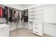 Spacious walk-in closet with custom shelving, drawers, and ample storage space at 4 Greenridge Rd, Greenwood Village, CO 80111