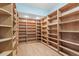 Spacious walk-in closet with custom built-in shelving and ample storage space at 18844 Ute Vista Trl, Morrison, CO 80465