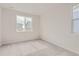 Bedroom featuring neutral walls, carpeted floor, and two windows at 14109 Deertrack Ln, Parker, CO 80134