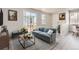 Comfortable living room with large sliding glass doors and neutral decor at 14109 Deertrack Ln, Parker, CO 80134