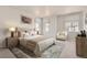 Bedroom featuring a Queen bed, nightstands, chair, and decor at 14109 Deertrack Ln, Parker, CO 80134