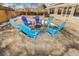 Inviting backyard space with colorful Adirondack chairs around a fire pit at 951 S Fulton St, Aurora, CO 80247