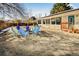 Beautiful backyard featuring a hot tub, lounge chairs, hammock, and gravel at 951 S Fulton St, Aurora, CO 80247