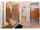 Bathroom featuring a glass shower, and entry to the walk-in closet at 951 S Fulton St, Aurora, CO 80247