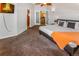 Cozy bedroom featuring a flatscreen television and multiple access doors at 951 S Fulton St, Aurora, CO 80247