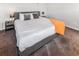 Cozy bedroom features a plush bed, bedside tables, and a warm, inviting ambiance at 951 S Fulton St, Aurora, CO 80247