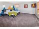 Large primary bedroom boasts wall decor and a TV, creating a peaceful sanctuary at 951 S Fulton St, Aurora, CO 80247